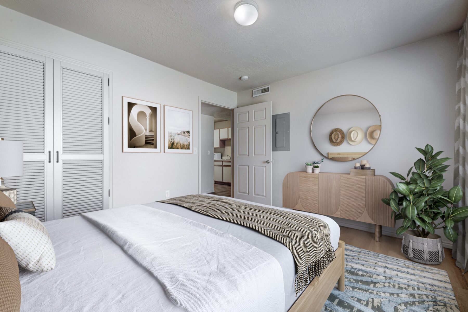 A cozy bedroom with a neatly made bed, dresser with a mirror, and a plant on the floor.